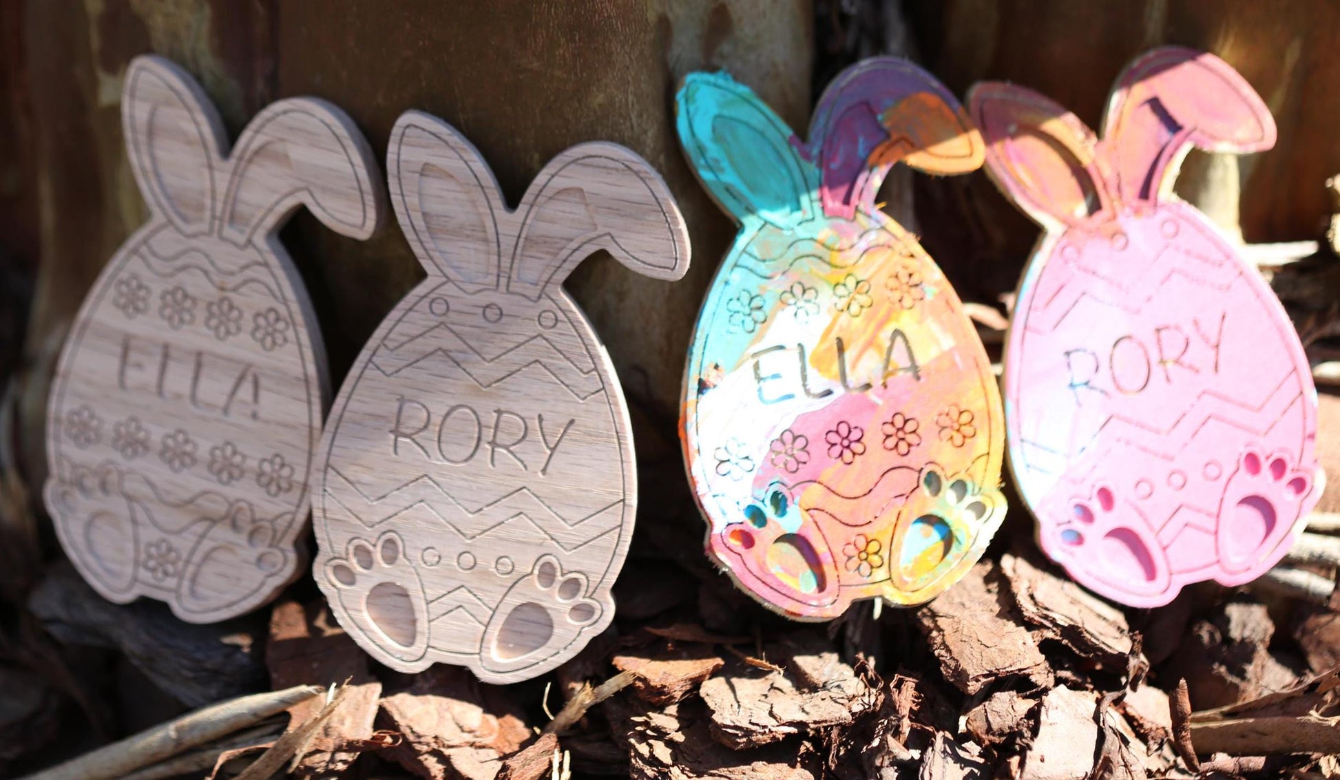 Personalized Easter eggs shown in multiple styles for an Easter egg hunt both painted and unpainted with bunny ears and bunny feet.