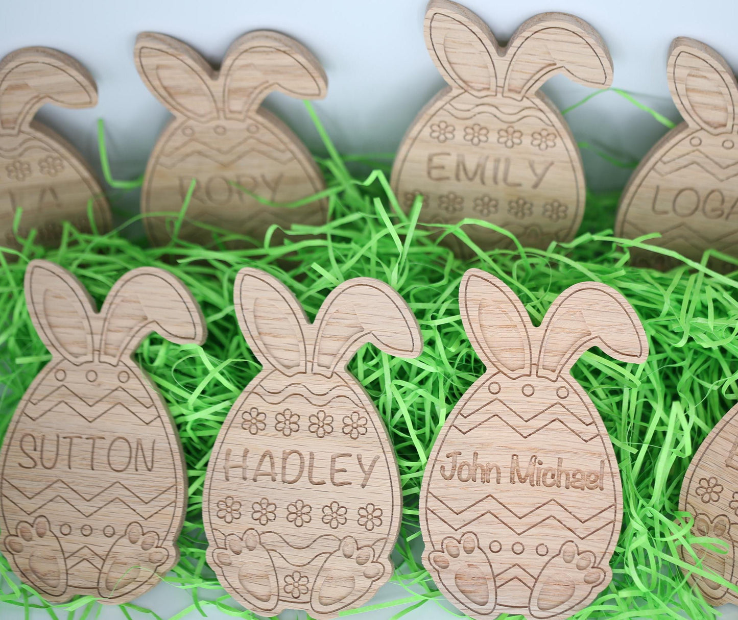 Personalized Easter eggs shown in multiple styles with bunny ears and bunny feet.